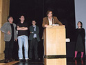 Paulo Branco (Membro do Juri da Competição Internacional) anunciando o prémio para a melhor curta metragem documental) com Luciano Barisone (Membro do Júri da Competição Internacional) e Serge Tréfaut, Nuno Sena e Ana Isabel Strindberg (direcção do Festival doclisboa 2004)